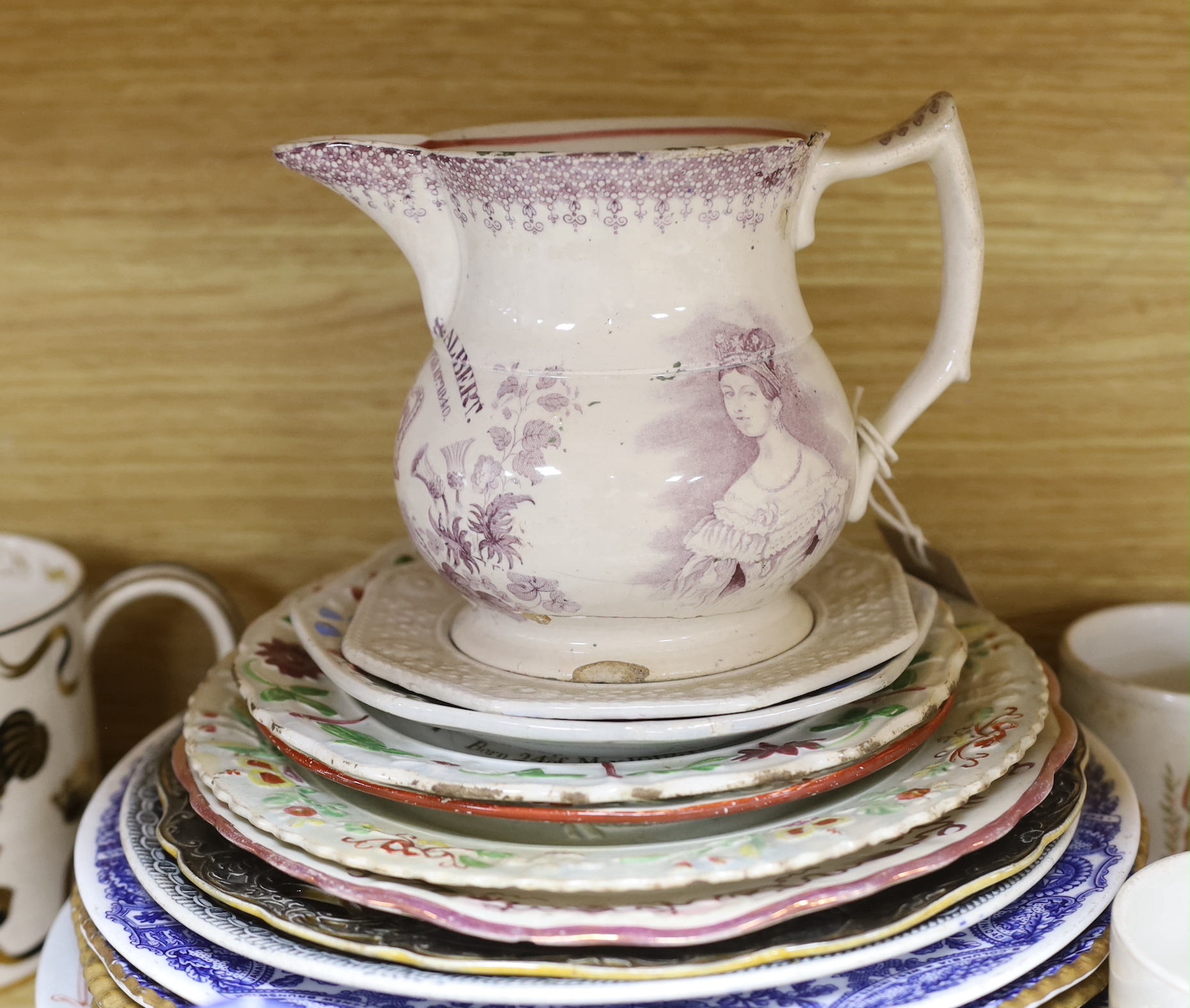 A mixed varied collection of 19th century and later commemorative wares to include a Princess Charlotte lustre cup and saucer, Victoria and Albert nursing plates, cups etc, the largest 25cm in diameter